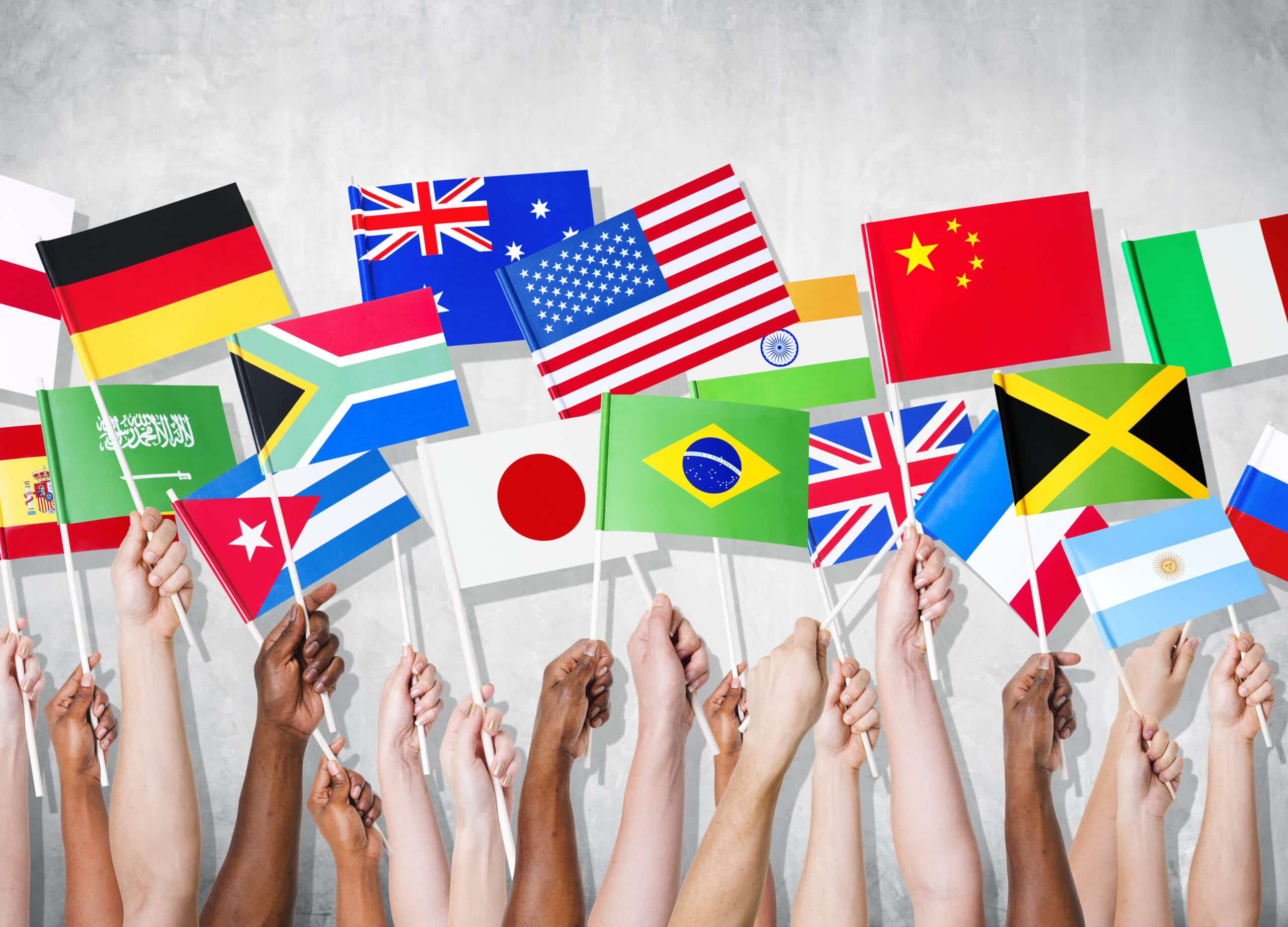 Multi-Ethnic Group of People Holding National Flags